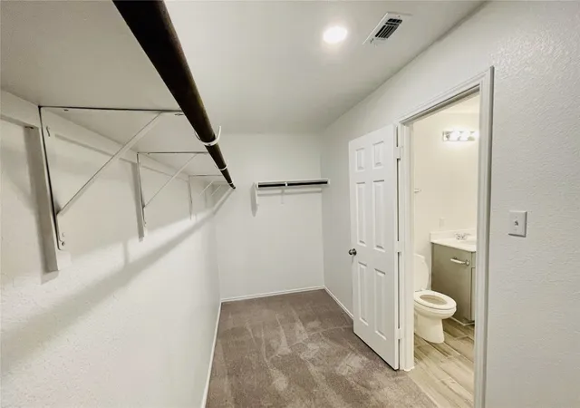 a bathroom with a sink and toilet