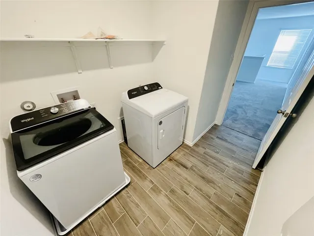 a utility room with washer and dryer