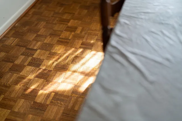 a living room with furniture a flat screen tv and a window