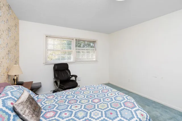 a bathroom with a sink a mirror and a shower curtain