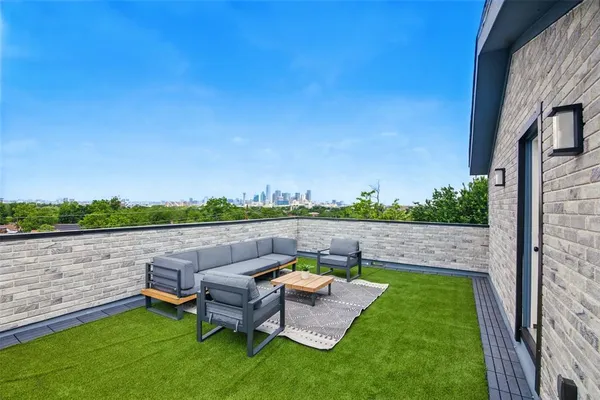 a view of sitting area with furniture and city view