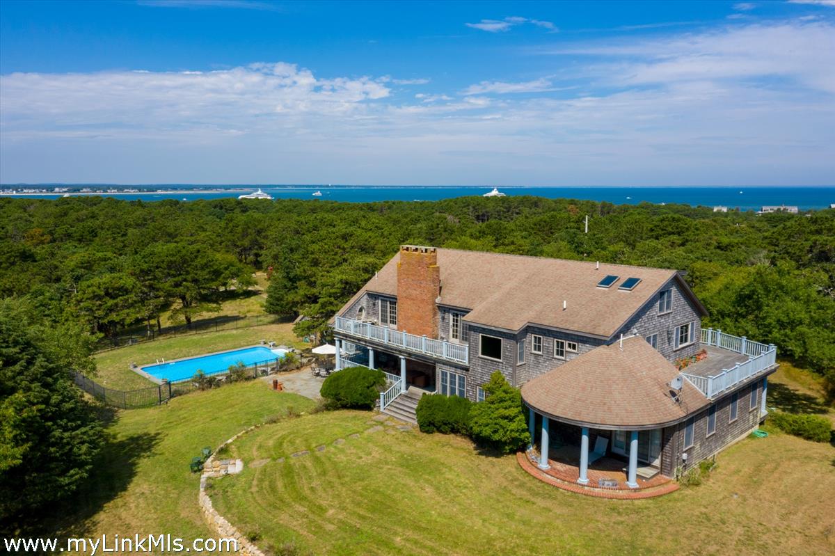 56 North Neck Road Edgartown, MA 02539 - Photo 56 of 63 an aerial view of a house with pool ocean view and mountain view