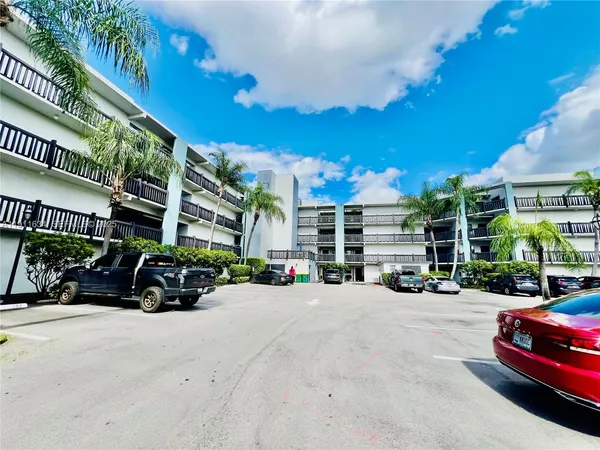 a view of a car park in front of a building