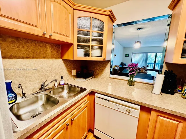 a kitchen with a sink and a cabinets