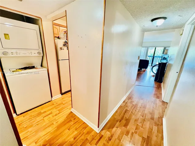a view of hallway with washer and dryer
