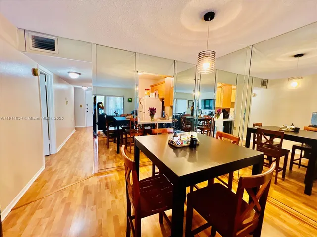 a view of a dining room with furniture and a table