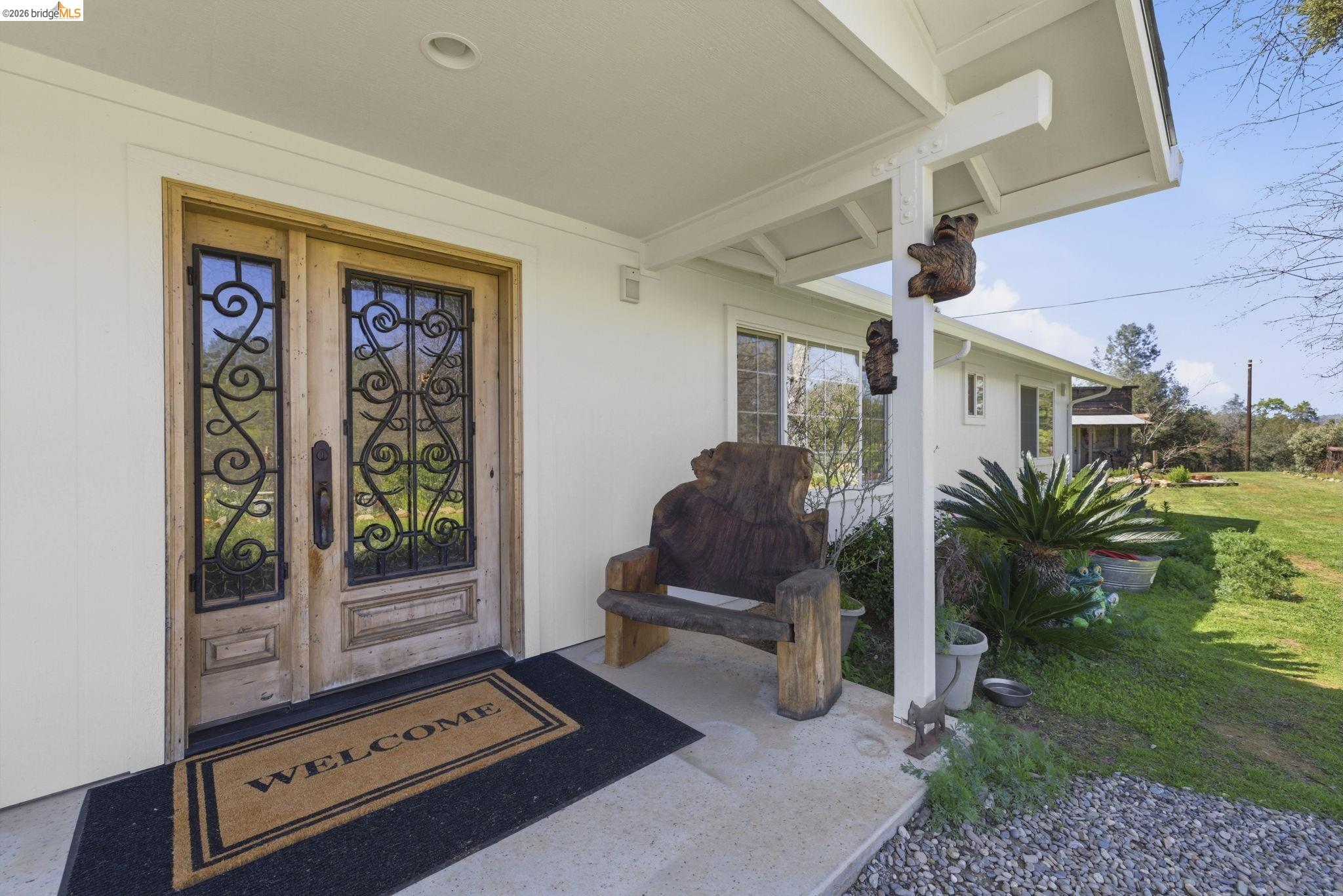 5356 Dogtown Road Coulterville, CA 95311 - Photo 14 of 60 a room with furniture and a floor to ceiling window