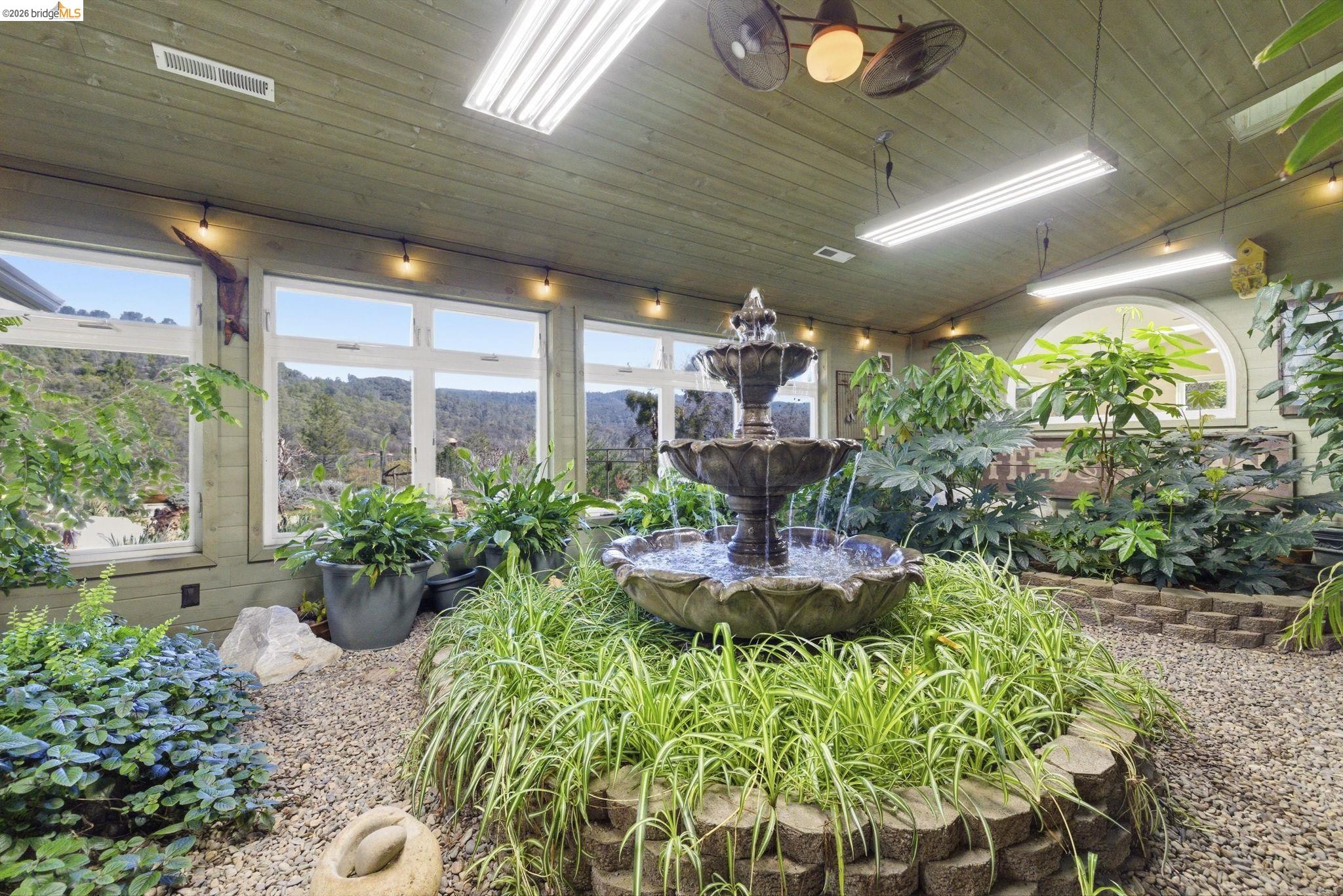 5356 Dogtown Road Coulterville, CA 95311 - Photo 18 of 60 a view of a porch with chairs and potted plants