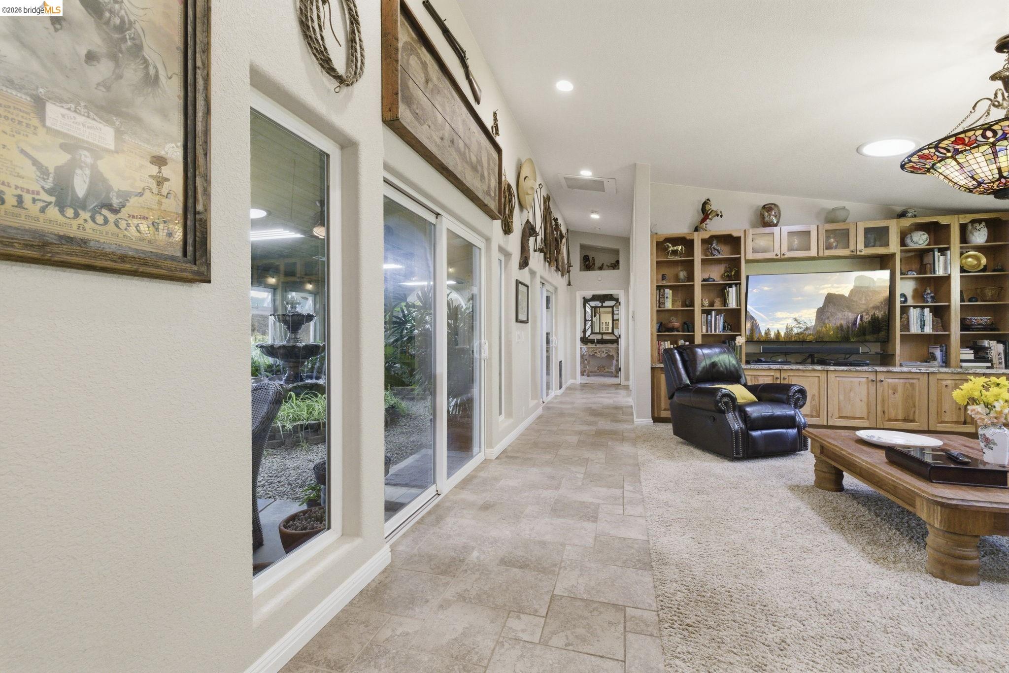 5356 Dogtown Road Coulterville, CA 95311 - Photo 21 of 60 a living room with furniture and a glass door