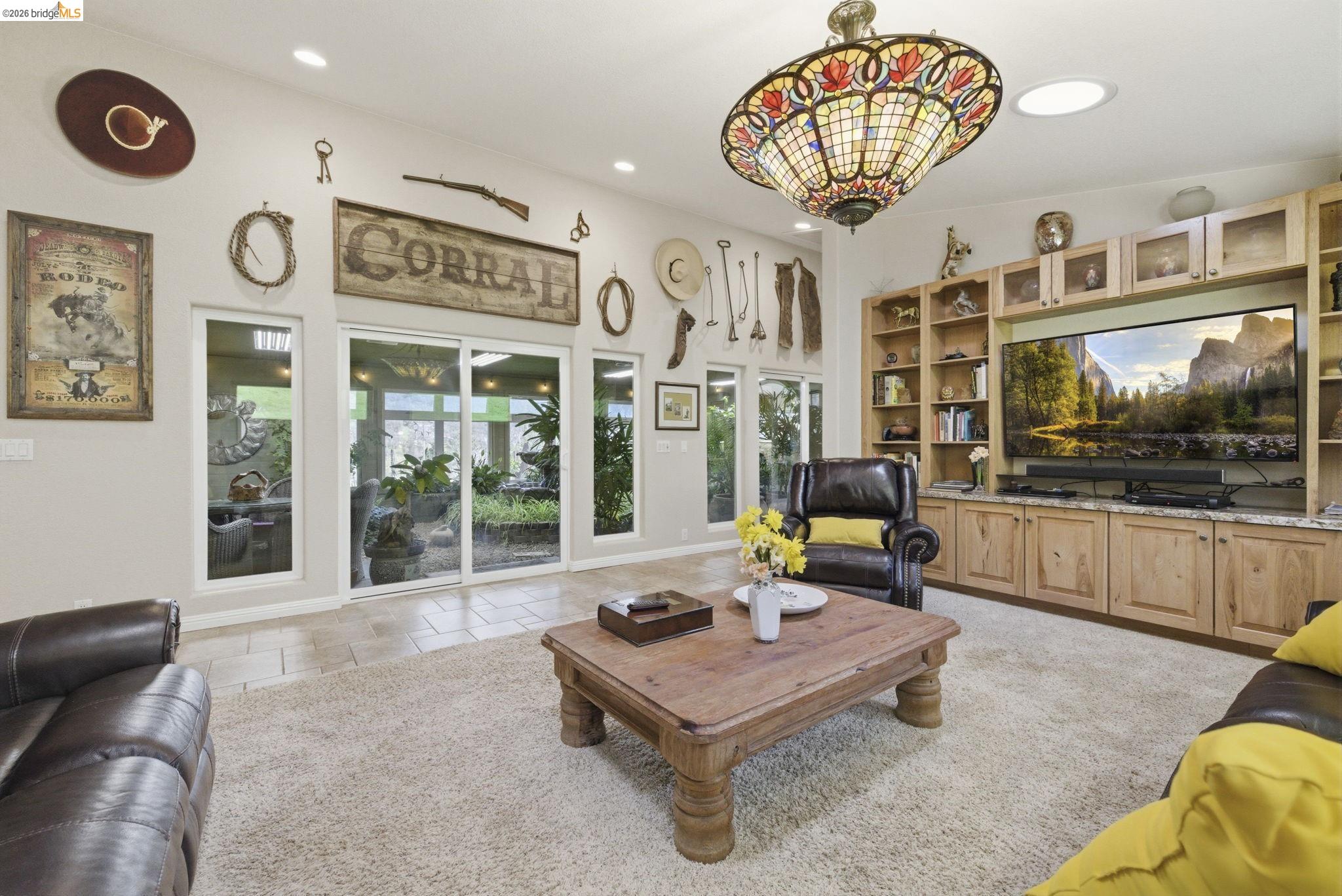 5356 Dogtown Road Coulterville, CA 95311 - Photo 22 of 60 a living room with furniture and a large window