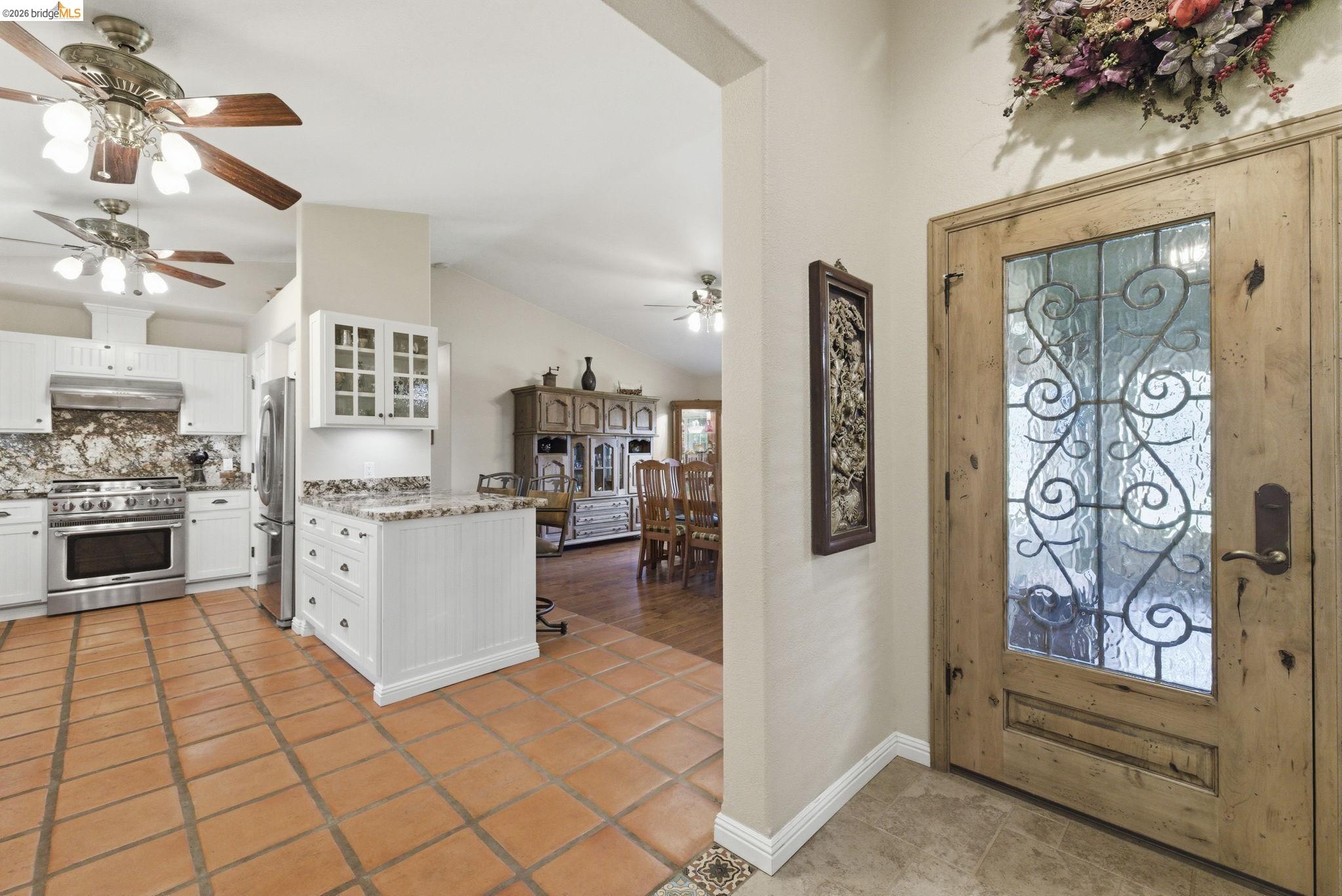 5356 Dogtown Road Coulterville, CA 95311 - Photo 25 of 60 a kitchen with white cabinets and white appliances