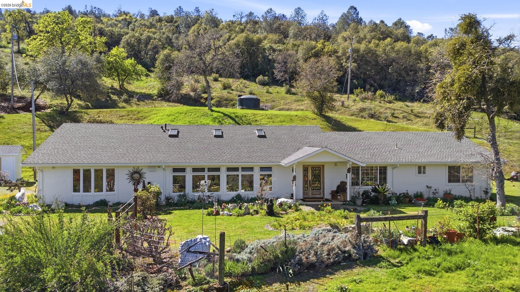 5356 Dogtown Road Coulterville, CA 95311 - Photo 3 of 60 a front view of a house with garden