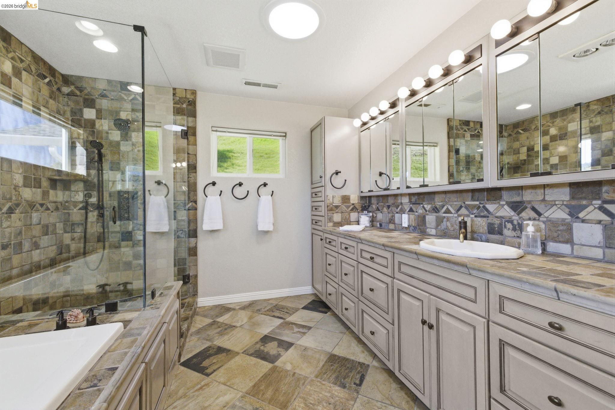 5356 Dogtown Road Coulterville, CA 95311 - Photo 41 of 60 a spacious bathroom with a double vanity sink mirror and shower