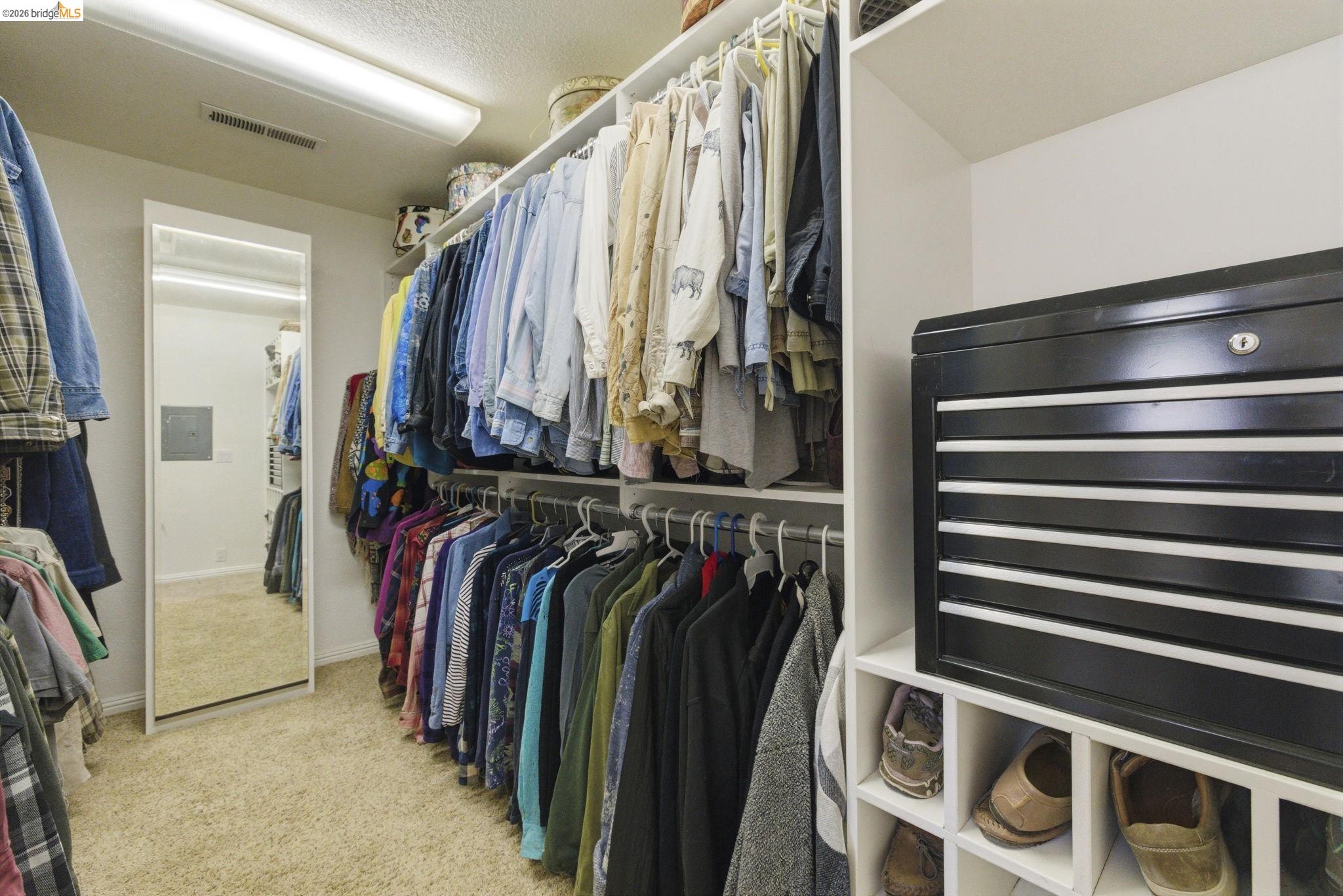 5356 Dogtown Road Coulterville, CA 95311 - Photo 45 of 60 a view of walk in closet with clothes and shoes