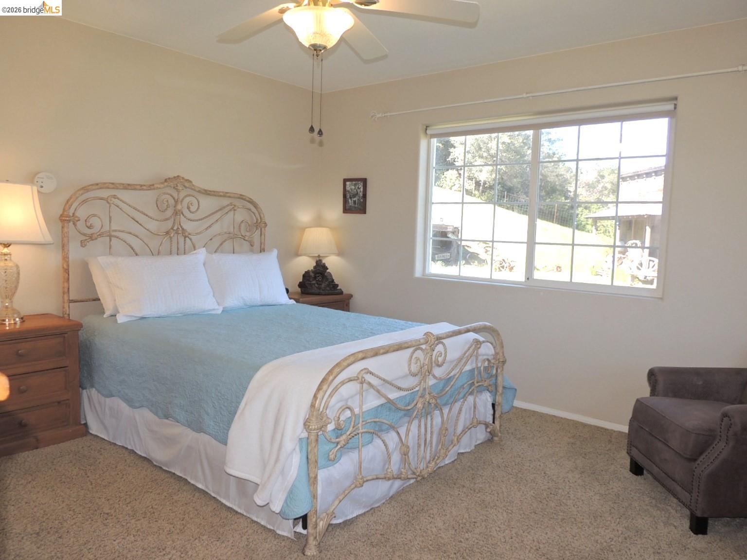 5356 Dogtown Road Coulterville, CA 95311 - Photo 46 of 60 a bedroom with a bed and a chair