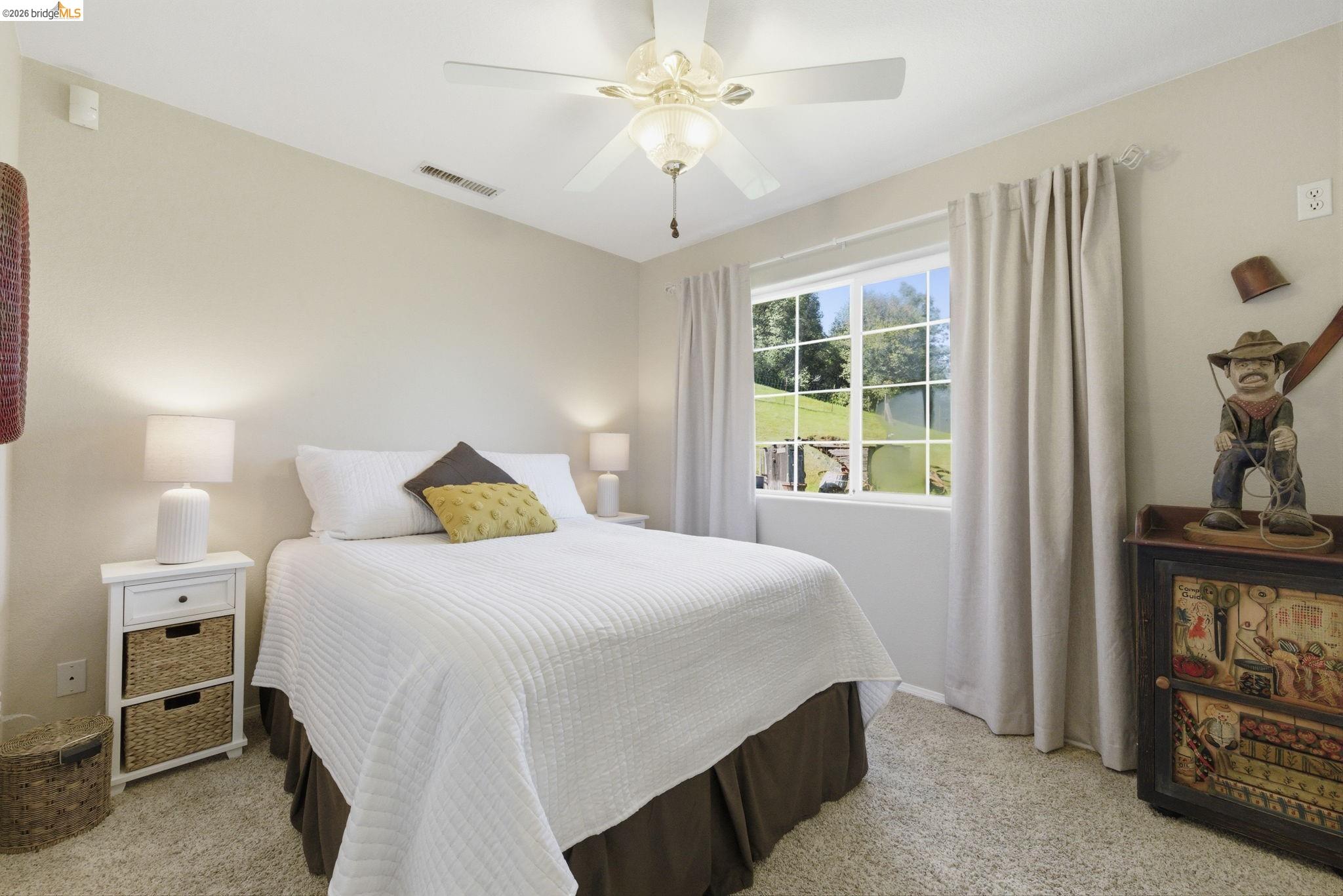 5356 Dogtown Road Coulterville, CA 95311 - Photo 50 of 60 a bedroom with a bed and a chandelier