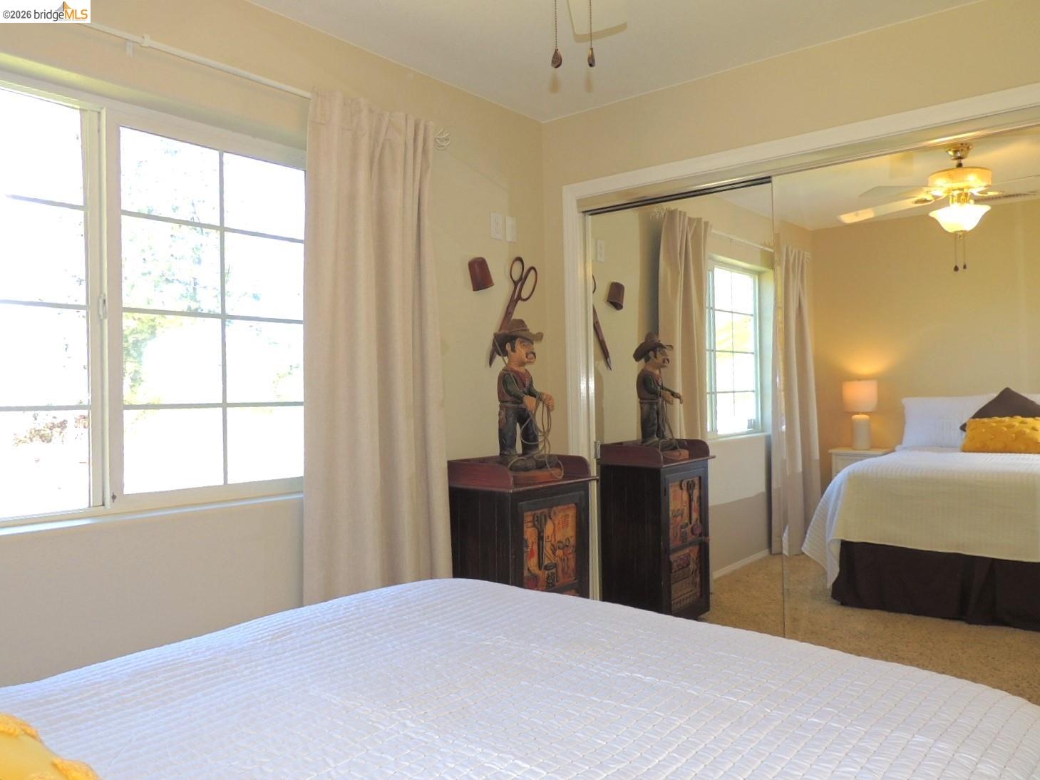 5356 Dogtown Road Coulterville, CA 95311 - Photo 51 of 60 a bedroom with a bed and wooden floor