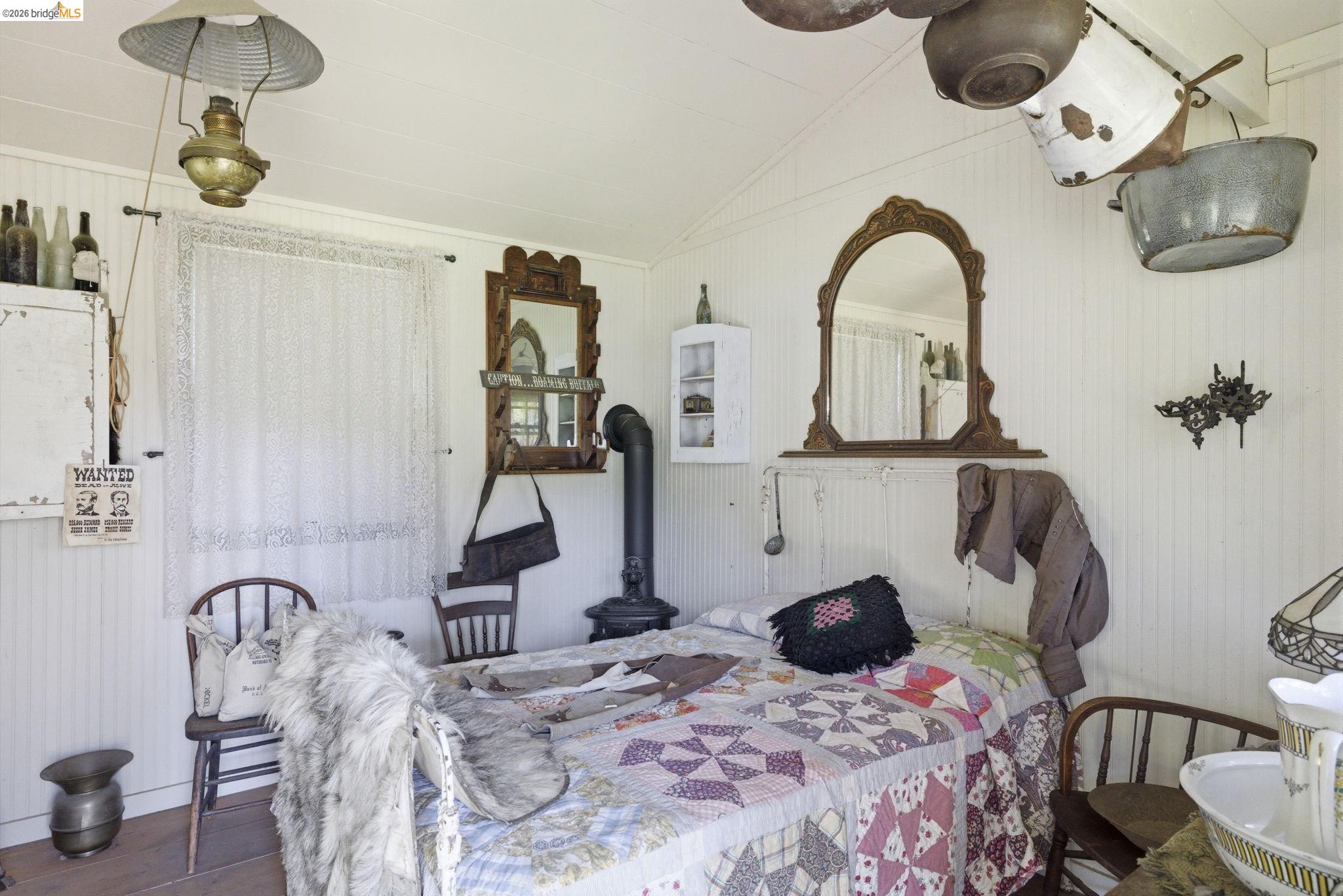 5356 Dogtown Road Coulterville, CA 95311 - Photo 55 of 60 a bedroom with bed and gym equipment