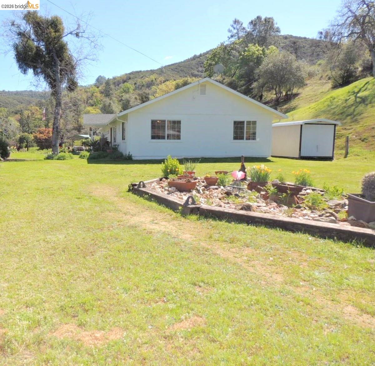 5356 Dogtown Road Coulterville, CA 95311 - Photo 57 of 60 a view of a swimming pool with a yard