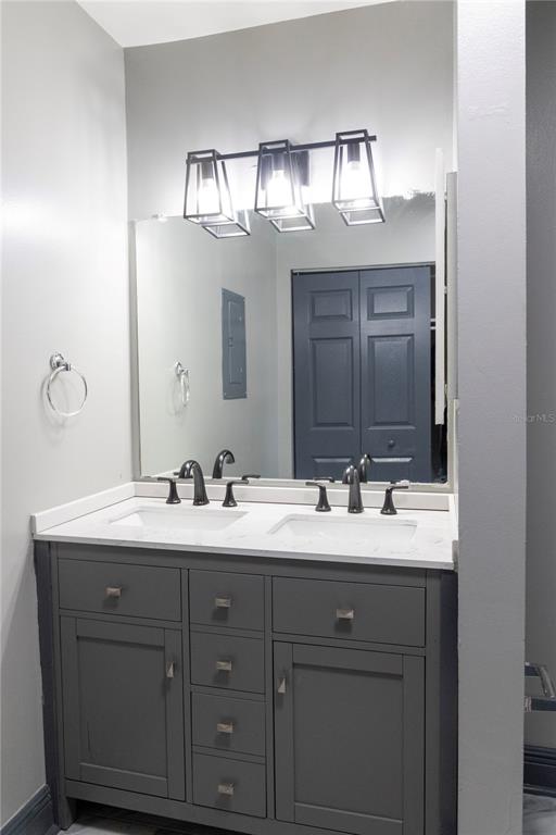 1799 North Highland Avenue, Unit 126 Clearwater, FL 33755 - Photo 11 of 20 a bathroom with a sink vanity and mirror
