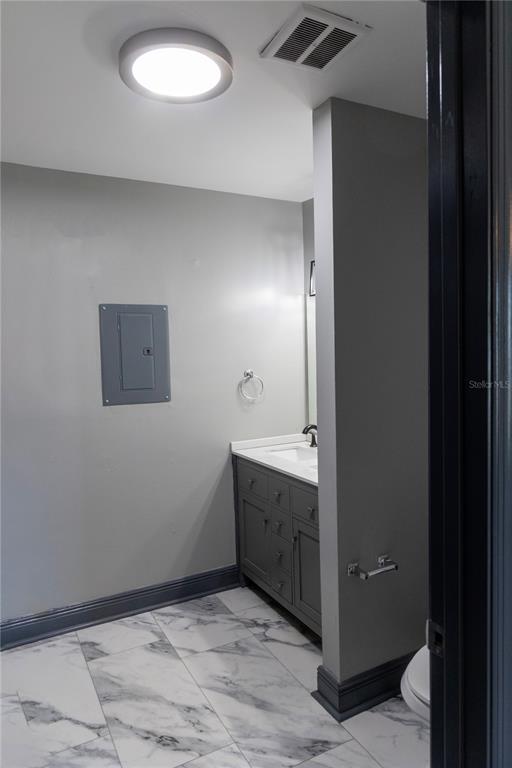 1799 North Highland Avenue, Unit 126 Clearwater, FL 33755 - Photo 12 of 20 a bathroom with a sink and mirror