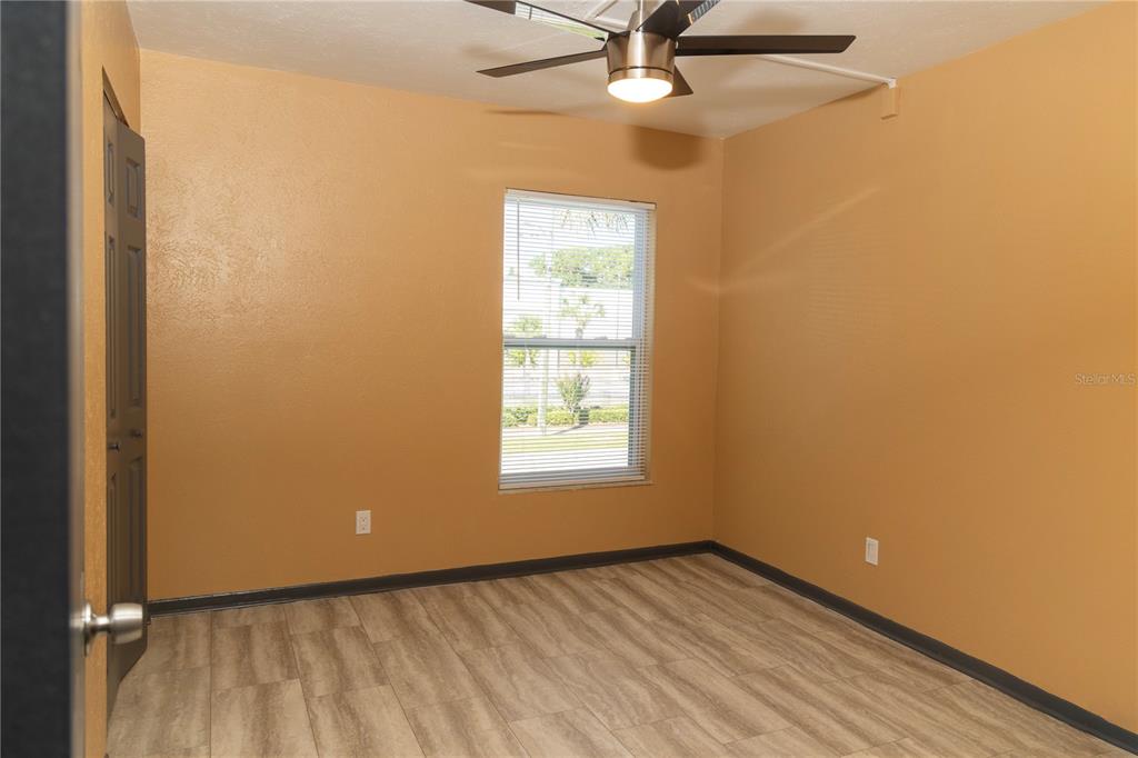 1799 North Highland Avenue, Unit 126 Clearwater, FL 33755 - Photo 16 of 20 an empty room with a window and a fan