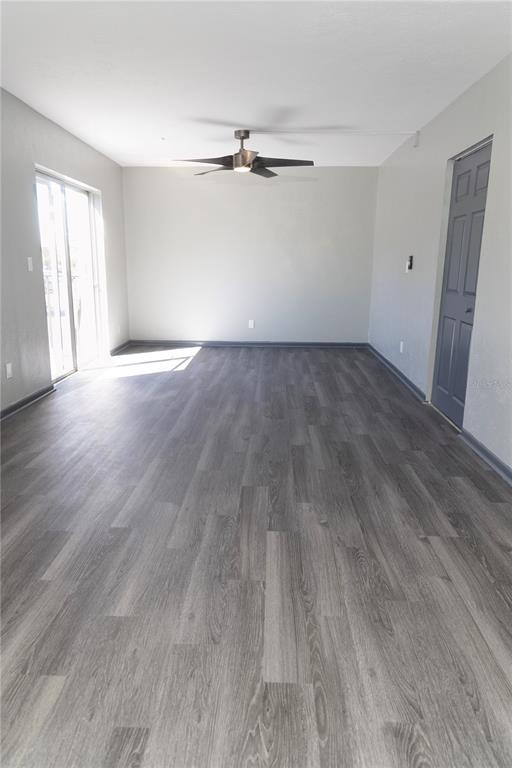 1799 North Highland Avenue, Unit 126 Clearwater, FL 33755 - Photo 3 of 20 wooden floor in an empty room with a window
