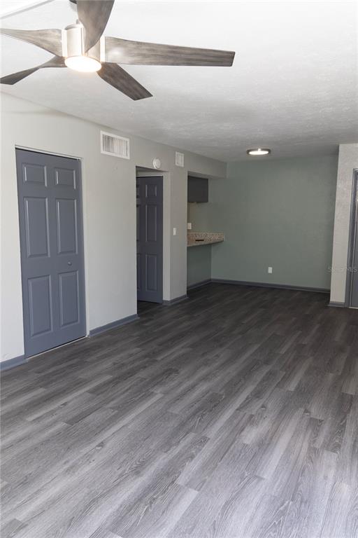 1799 North Highland Avenue, Unit 126 Clearwater, FL 33755 - Photo 4 of 20 wooden floor in an empty room with wooden floor