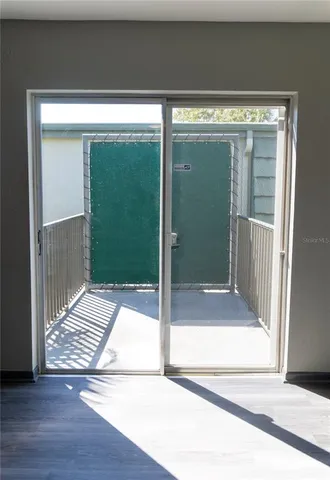 a view of entryway with a floor to ceiling window