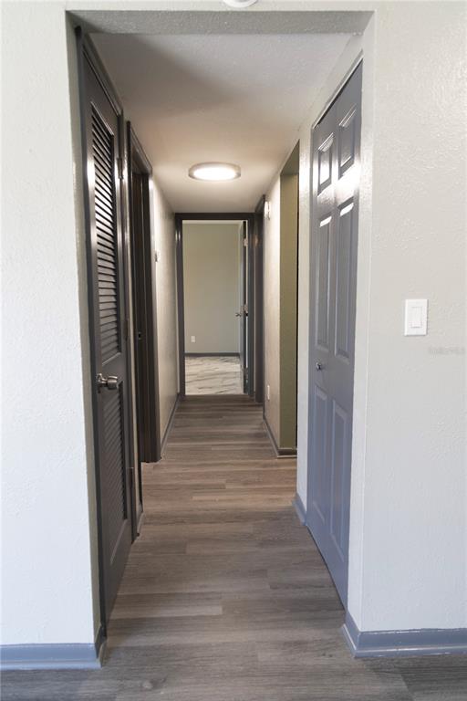 1799 North Highland Avenue, Unit 126 Clearwater, FL 33755 - Photo 9 of 20 a view of a hallway with wooden floor