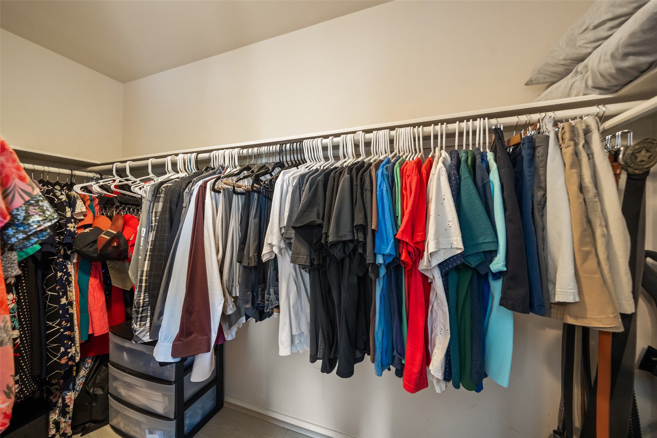 2613 Link Road Houston, TX 77009 - Photo 23 of 28 The primary closet is a clothing lover's delight with tons of room for clothing of all seasons.