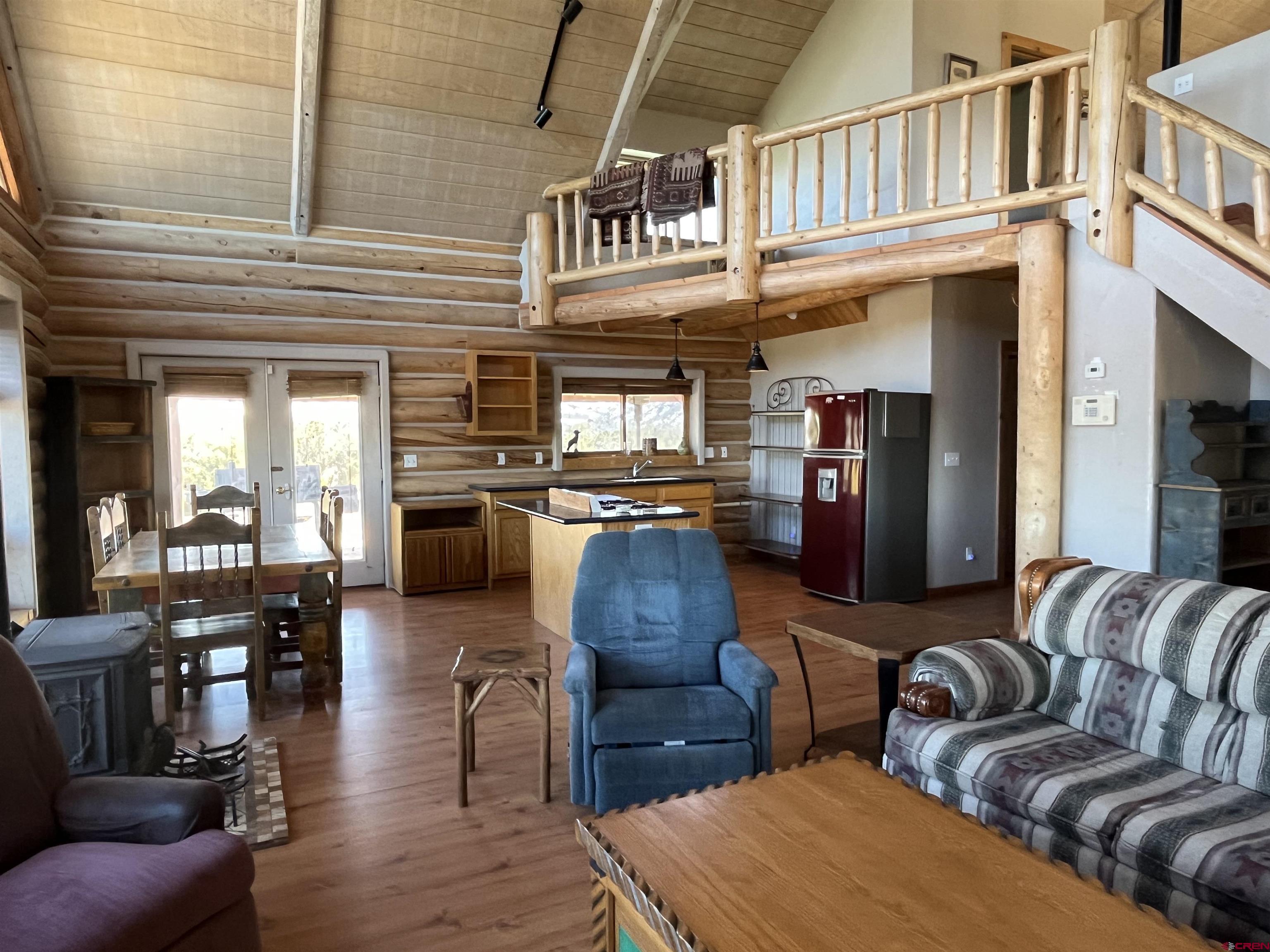 9571 Road 35 Mancos, CO 81328 - Photo 11 of 32 a living room with furniture and a flat screen tv