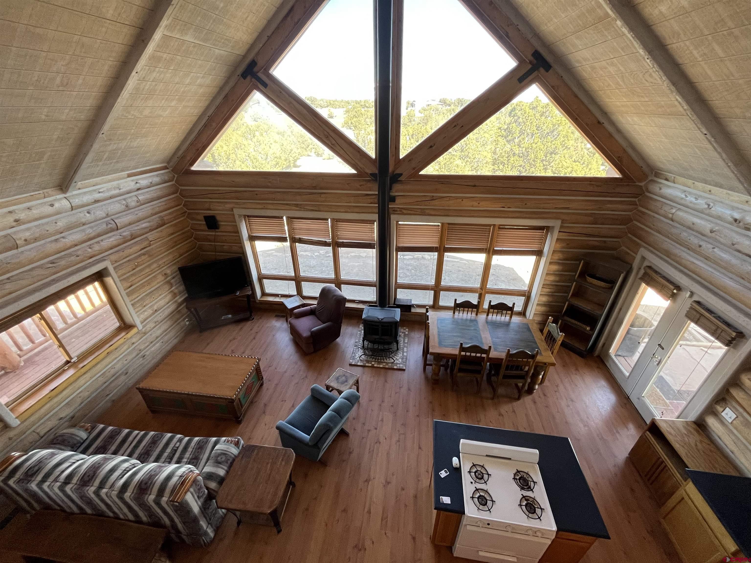 9571 Road 35 Mancos, CO 81328 - Photo 13 of 32 a living room with furniture and a large window