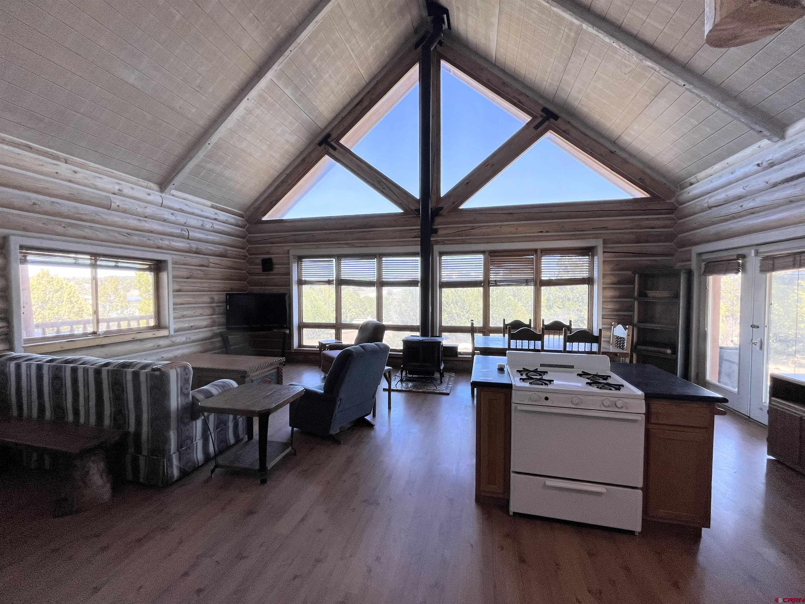 9571 Road 35 Mancos, CO 81328 - Photo 18 of 32 a view of a dining room with furniture window and wooden floor