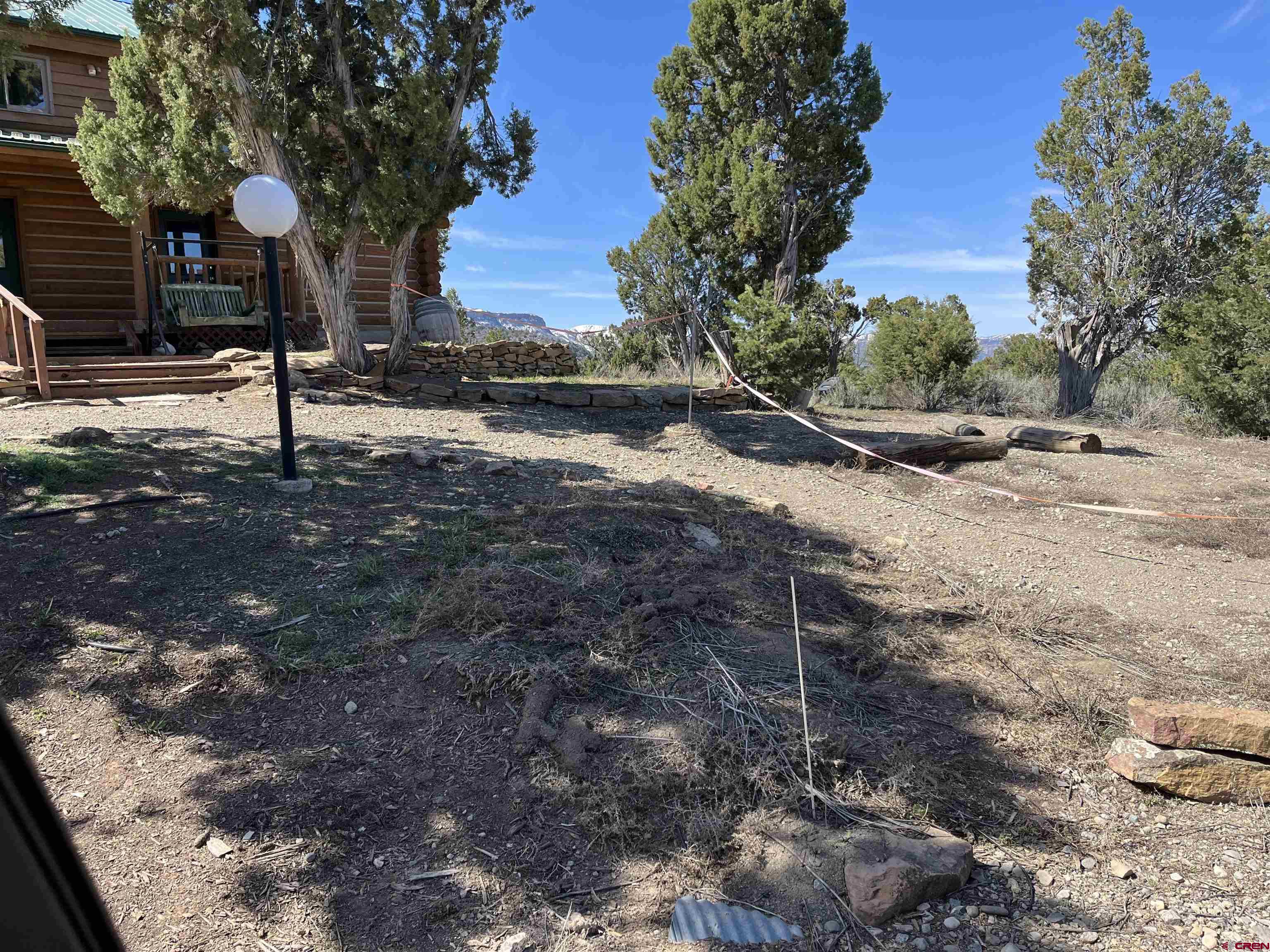 9571 Road 35 Mancos, CO 81328 - Photo 30 of 32 a backyard of a house with lots of green space