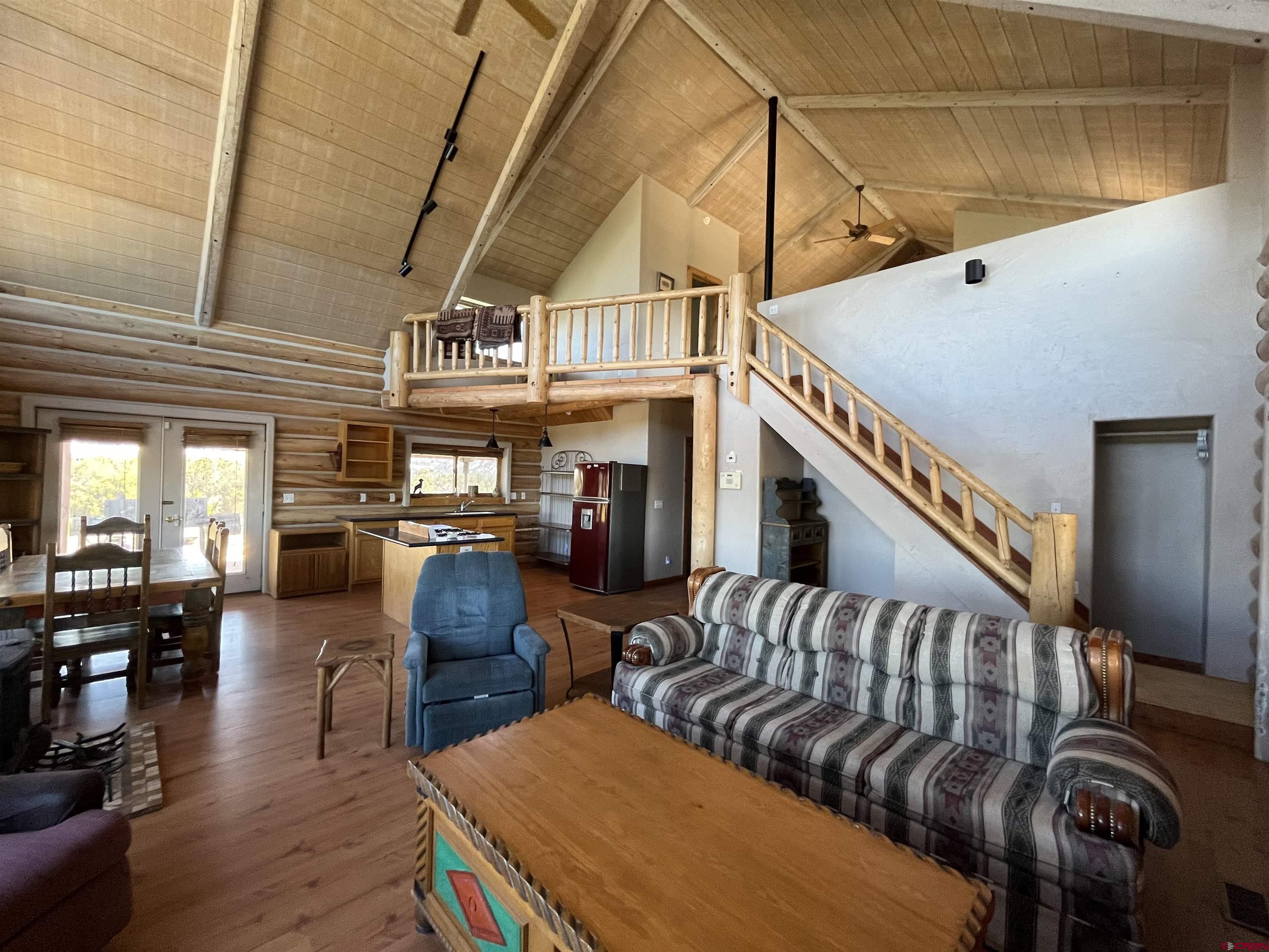 9571 Road 35 Mancos, CO 81328 - Photo 9 of 32 a living room with furniture and wooden floor