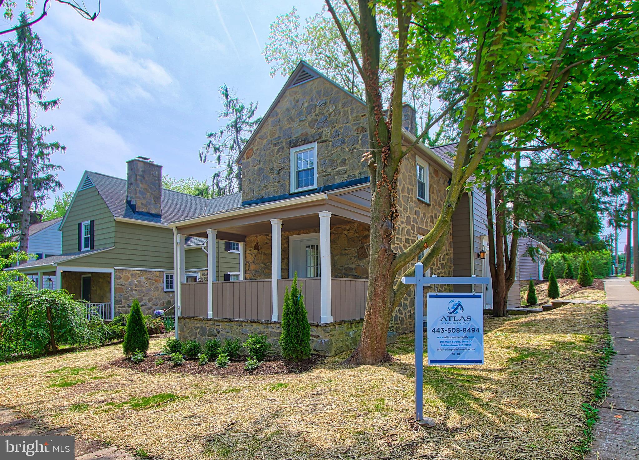 301 West Cold Spring Lane Baltimore, MD 21210 - Photo 2 of 38 a front view of a house with garden