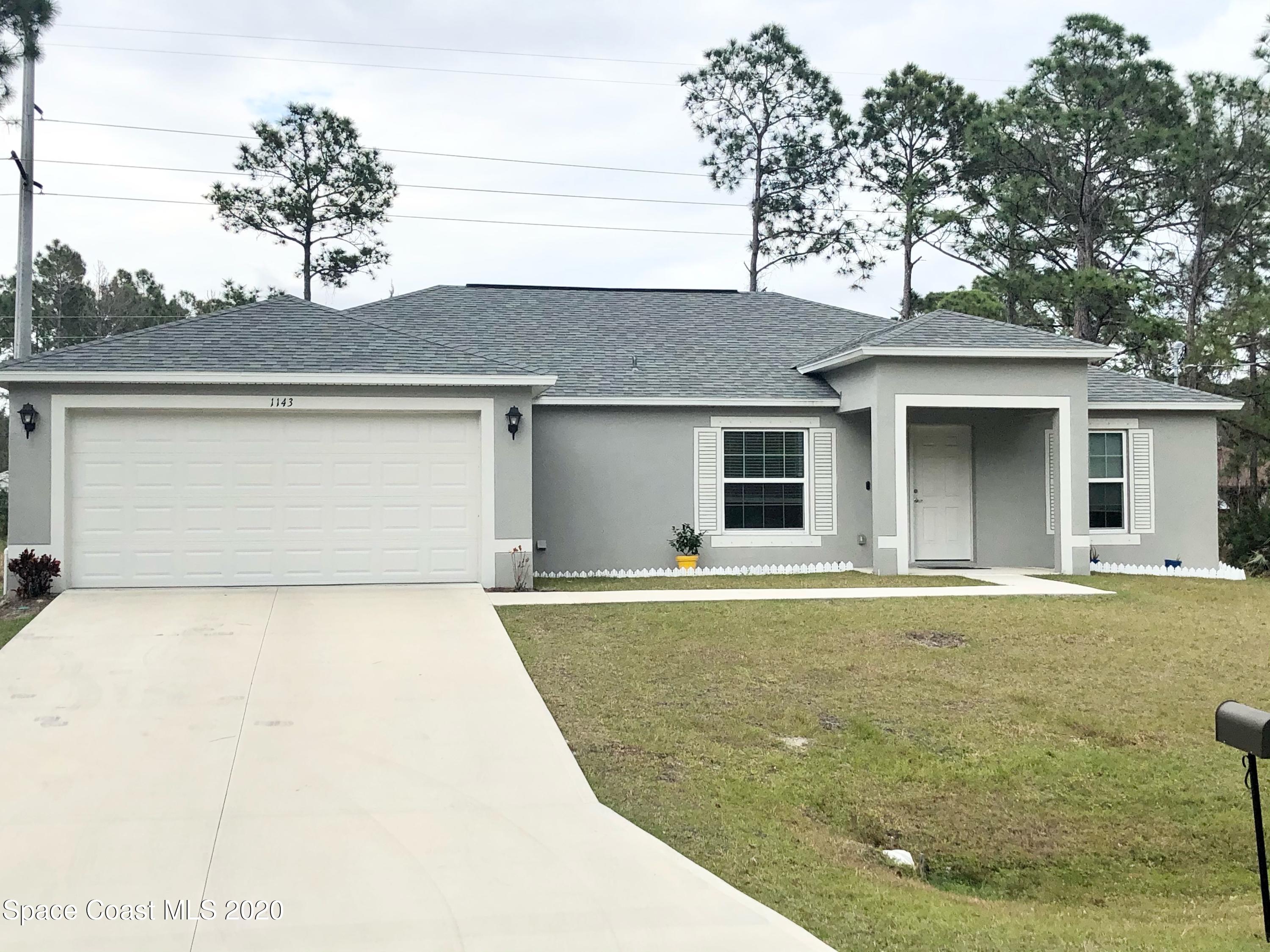 front view of a house with a garage
