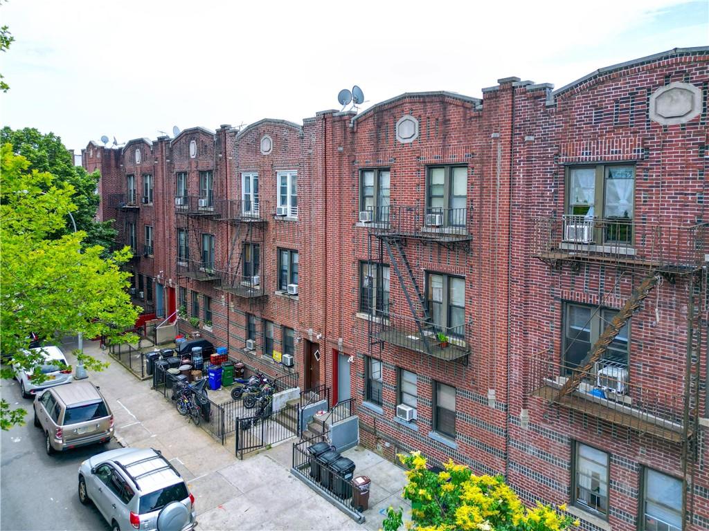 1748 79th Street Brooklyn, NY 11214 - Photo 4 of 20 a view of multiple houses with a street