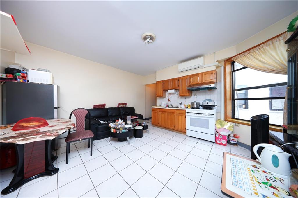 1748 79th Street Brooklyn, NY 11214 - Photo 7 of 20 a living room with furniture and flat screen tv