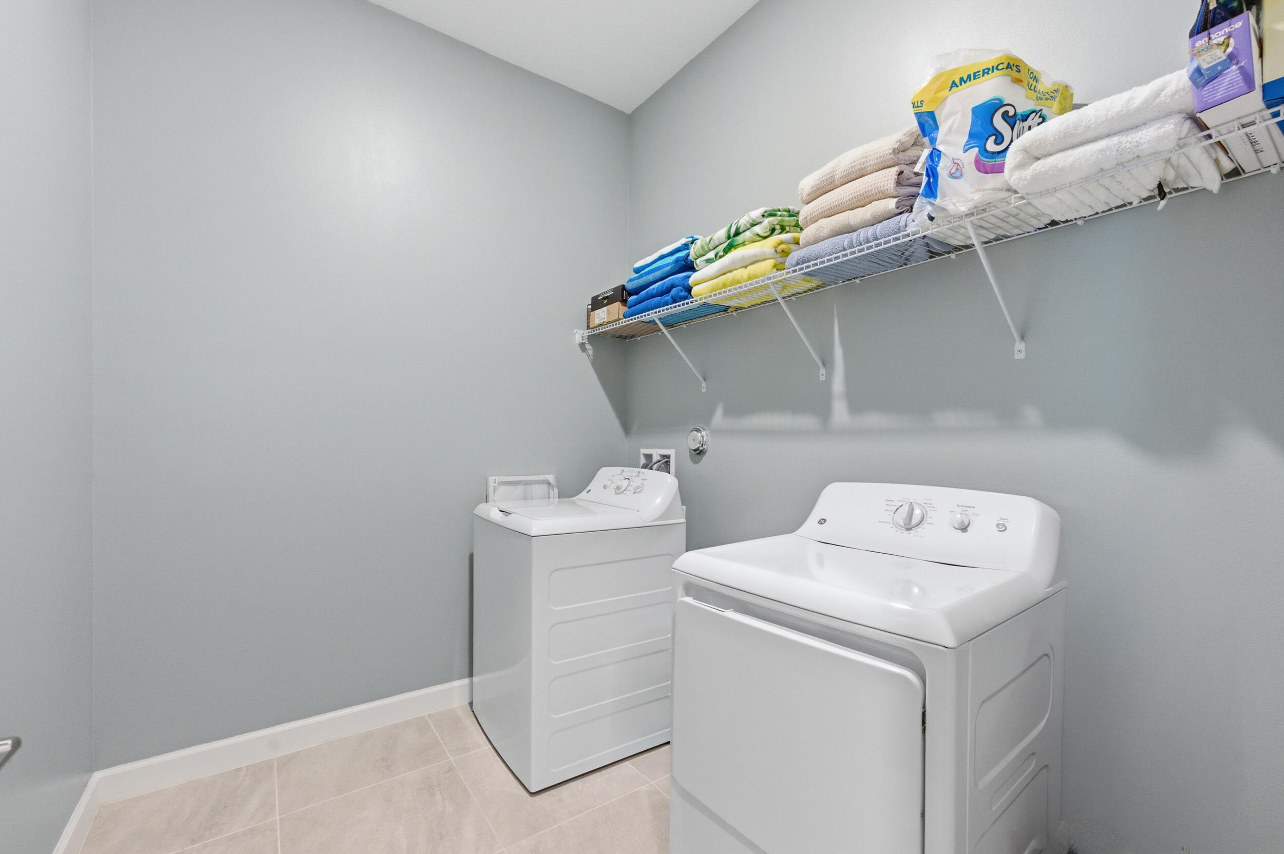 19230 Rolling Acres Road Loxahatchee, FL 33470 - Photo 29 of 58 a utility room with dryer and washer