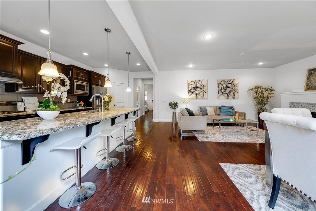 20057 94th Avenue Northeast, Unit 36 Bothell, WA 98011 - Photo 11 of 31 a living room with stainless steel appliances furniture or kitchen view and a wooden floor
