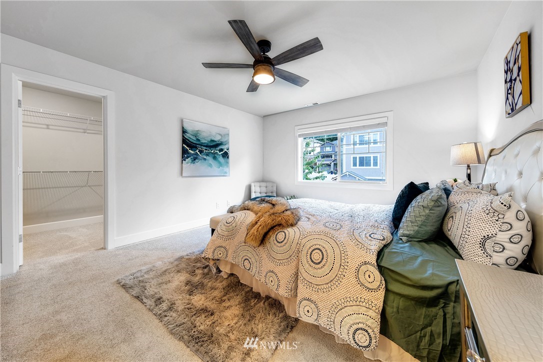 20057 94th Avenue Northeast, Unit 36 Bothell, WA 98011 - Photo 20 of 31 a bed room with a bed and a window