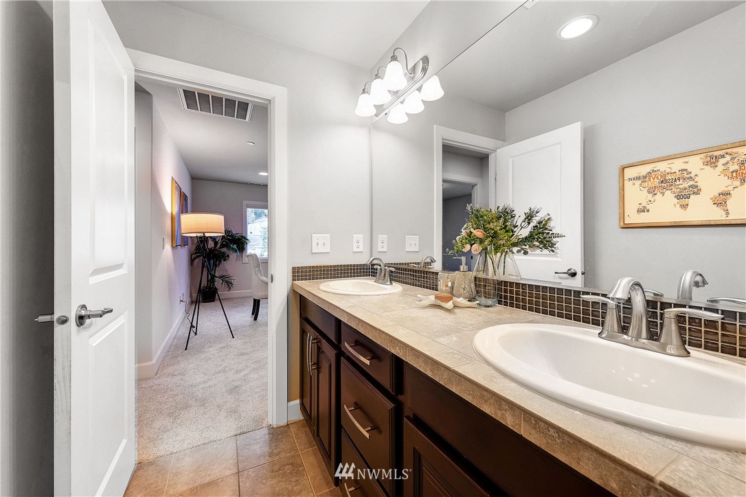 20057 94th Avenue Northeast, Unit 36 Bothell, WA 98011 - Photo 21 of 31 a bathroom with a sink double vanity and a mirror