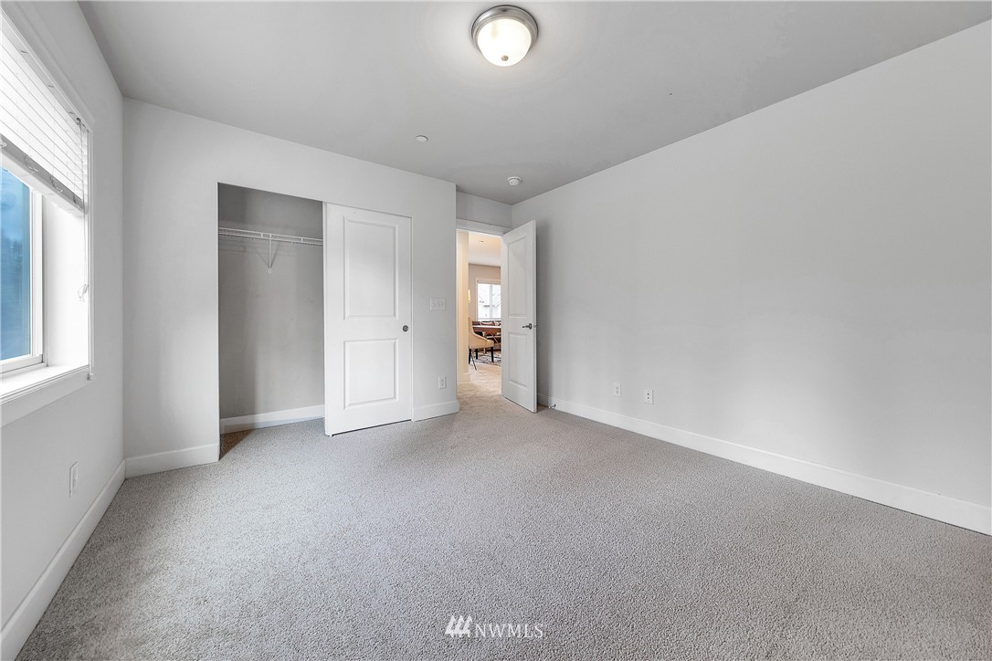 20057 94th Avenue Northeast, Unit 36 Bothell, WA 98011 - Photo 24 of 31 an empty room with windows and closet