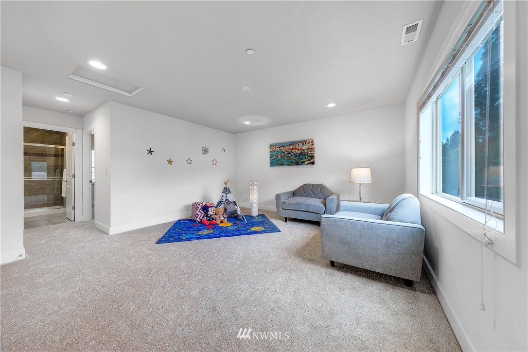20057 94th Avenue Northeast, Unit 36 Bothell, WA 98011 - Photo 25 of 31 a living room with furniture and a large window