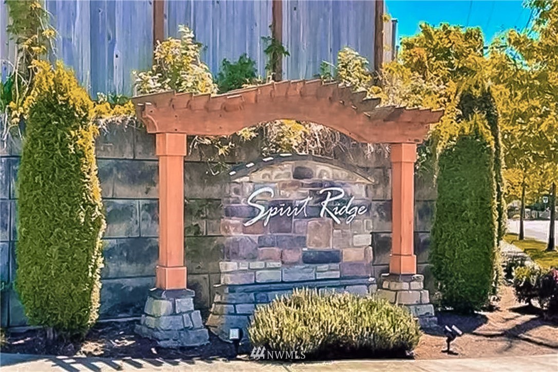 20057 94th Avenue Northeast, Unit 36 Bothell, WA 98011 - Photo 31 of 31 a sign that is sitting in front of a wooden fence