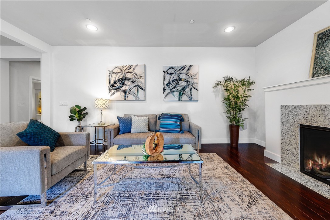 20057 94th Avenue Northeast, Unit 36 Bothell, WA 98011 - Photo 7 of 31 a living room with furniture and a fireplace