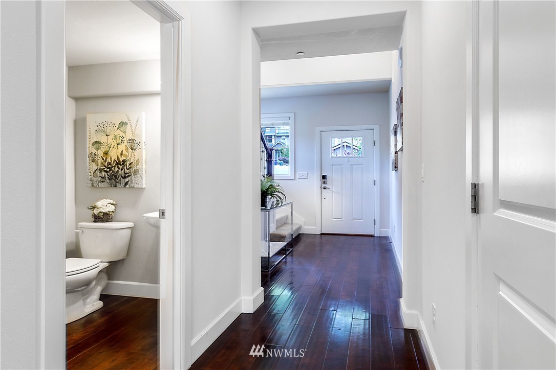 20057 94th Avenue Northeast, Unit 36 Bothell, WA 98011 - Photo 10 of 31 a bathroom with a toilet and a hardwood floor