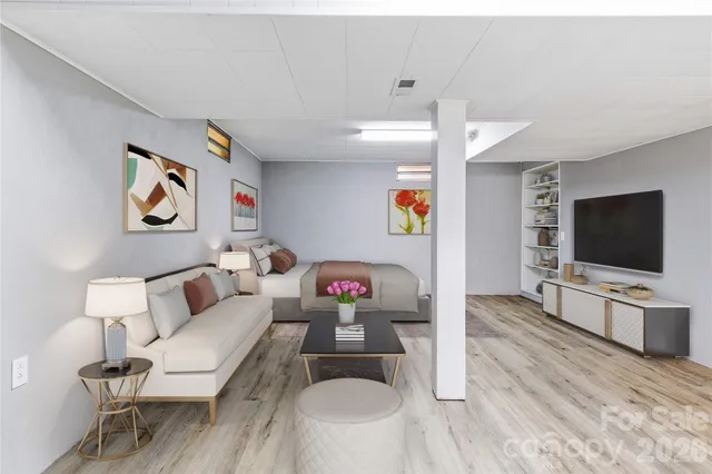 a living room with furniture and a flat screen tv